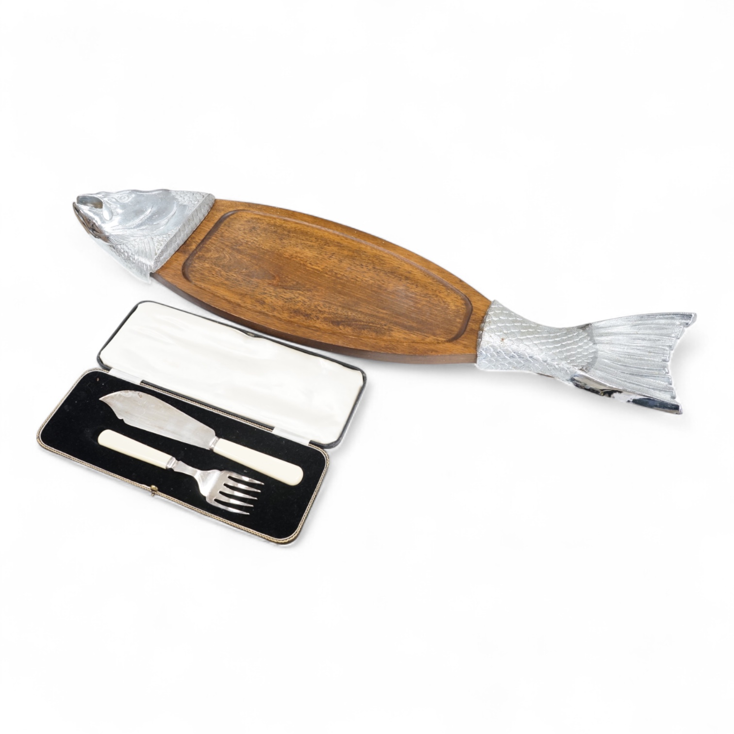 A wooden 'Fish' serving platter with plated mounts and a pair of servers, platter 87cm long